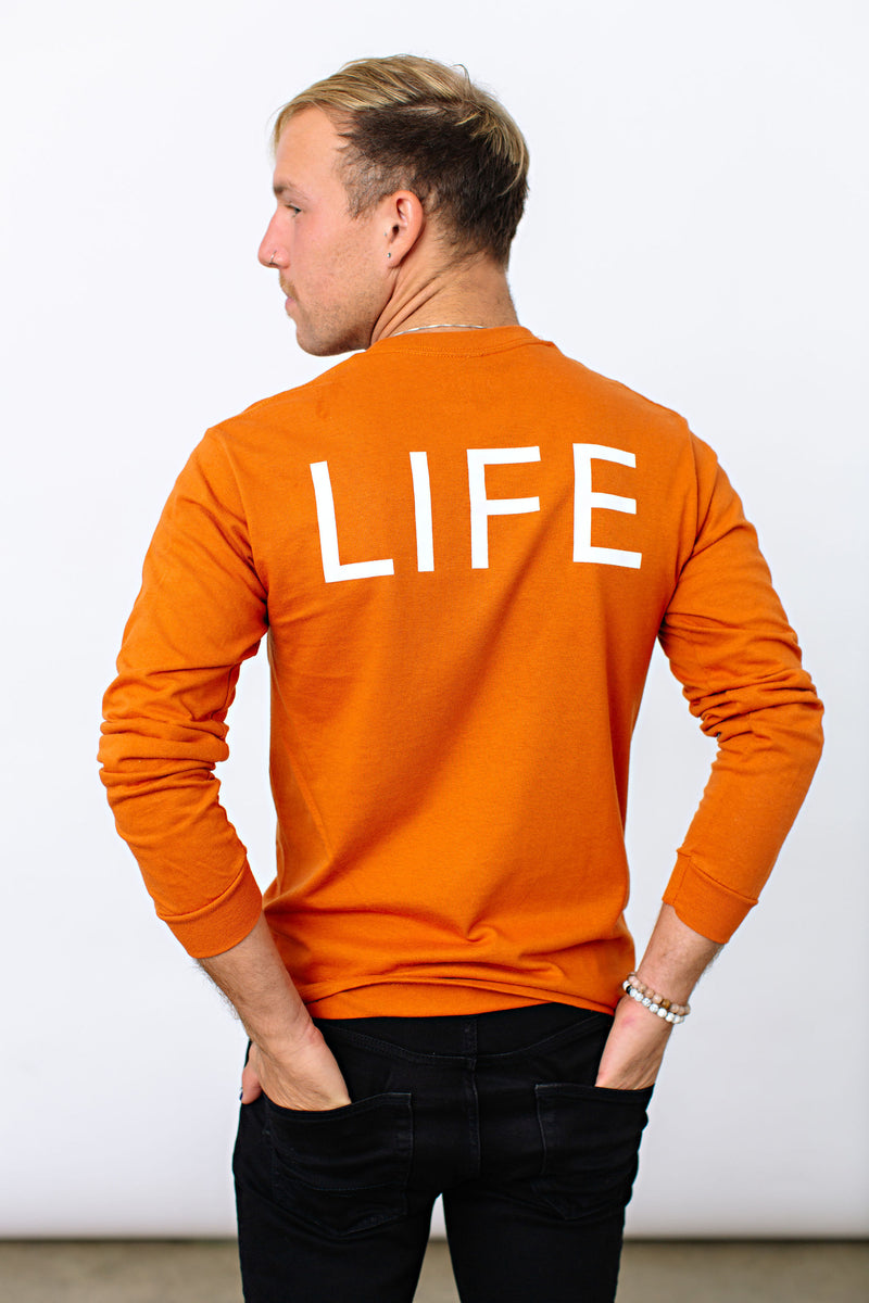 Okanagan Lifestyle orange long sleeve shirt with LIFE printed in white on back