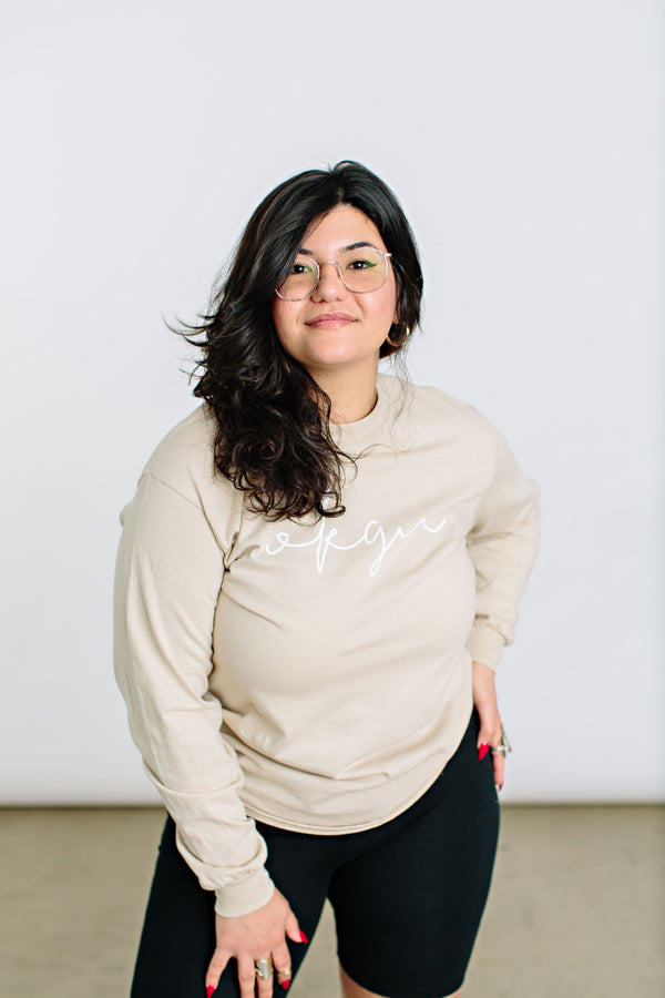 Okanagan Lifestyle beige long sleeve shirt with OKGN printed on front in cursive font